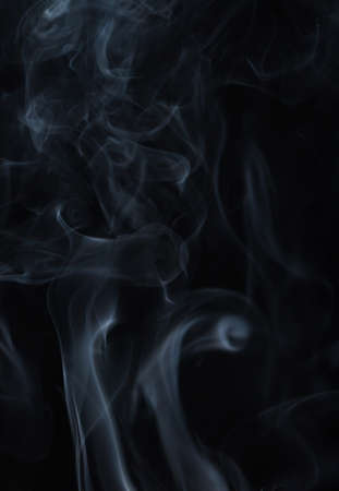 Abstract white smoke on black backgroundの写真素材