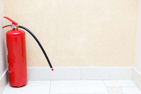 fire extinguisher in the corner of the roomの写真素材