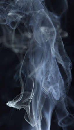 Abstract white smoke on black backgroundの写真素材