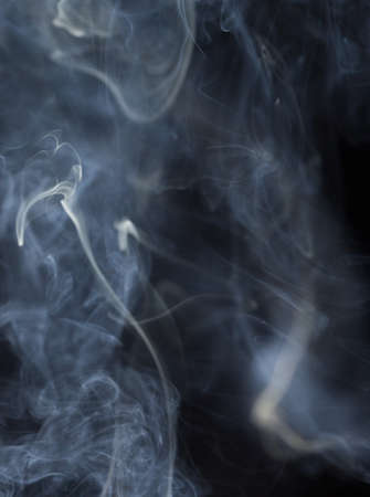 Abstract white smoke on black backgroundの写真素材