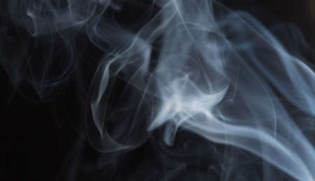 Abstract white smoke on black backgroundの写真素材