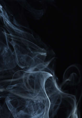Abstract white smoke on black backgroundの写真素材