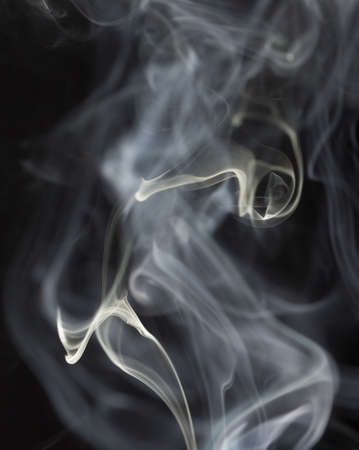 Abstract white smoke on black backgroundの写真素材