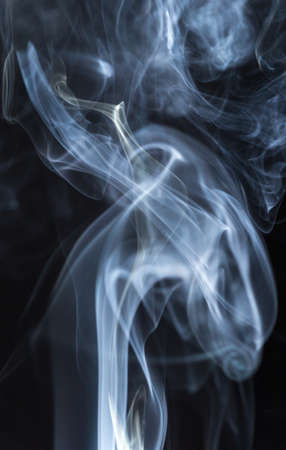 Abstract white smoke on black backgroundの写真素材