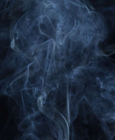 Abstract white smoke on black backgroundの写真素材
