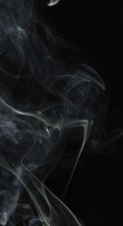 Abstract white smoke on black backgroundの写真素材