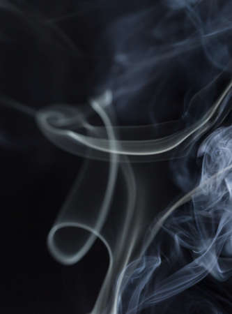 Abstract white smoke on black backgroundの写真素材