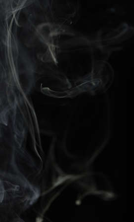 Abstract white smoke on black backgroundの写真素材