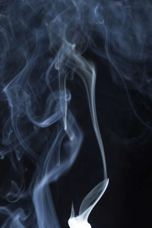 Abstract white smoke on black backgroundの写真素材