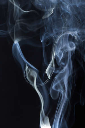 Abstract white smoke on black backgroundの写真素材