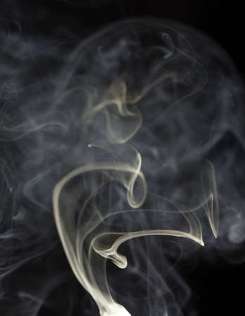Abstract white smoke on black backgroundの写真素材