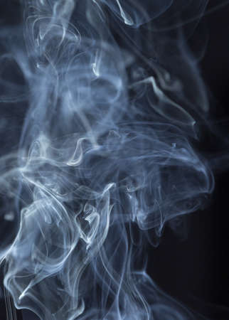 Abstract white smoke on black backgroundの写真素材