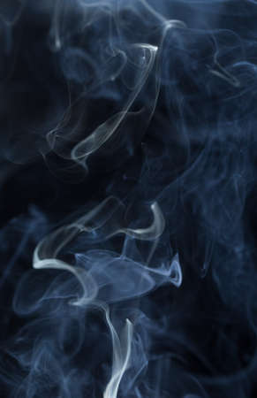 Abstract white smoke on black backgroundの写真素材