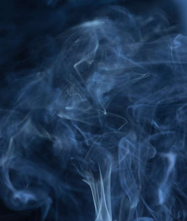 Abstract white smoke on black backgroundの写真素材