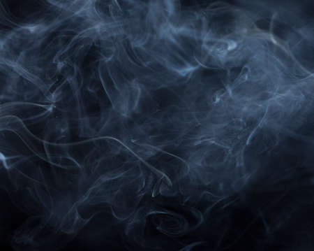 Abstract white smoke on black backgroundの写真素材