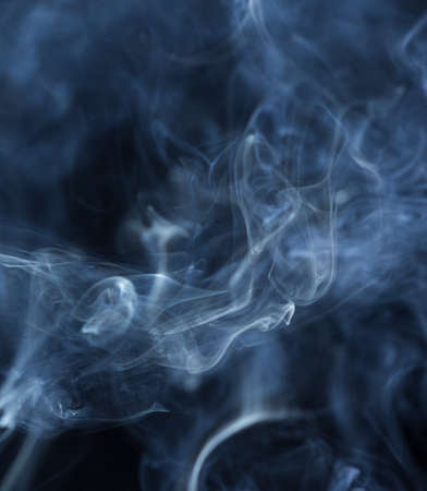 Abstract white smoke on black backgroundの写真素材