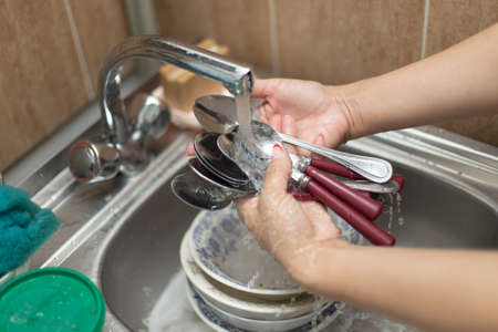 woman washing dishesの写真素材