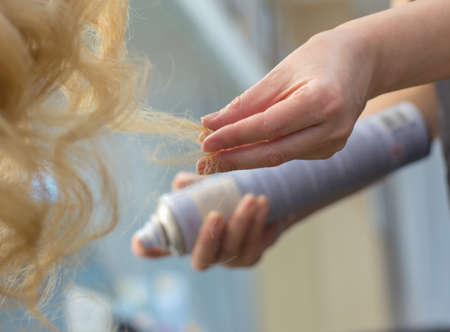 Training hairstyles on a mannequinの写真素材