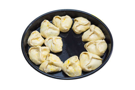 pies on a black sheet on a white backgroundの写真素材