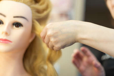 Training hairstyles on a mannequin