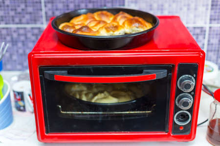 Hot samsa with lamb on the surface of the electric stoveの写真素材