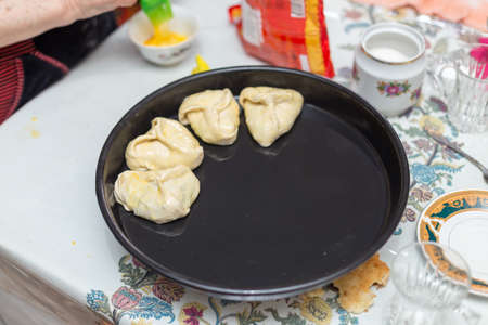 pies on a black sheet on the tableの写真素材