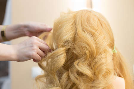 Training hairstyles on a mannequinの写真素材