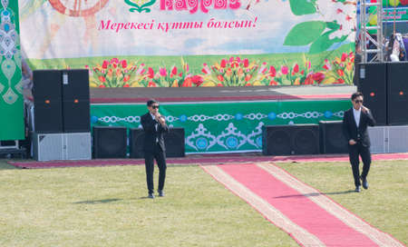 March 22, 2019 Almaty, Kazakhstan. Singers sing songs during the celebration of the Nauryz holidayのeditorial素材
