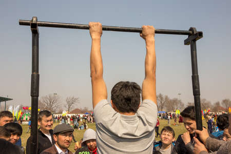 March 22, 2019 Almaty, Kazakhstan. Sports competitions in the horizontal bar during the celebration of the holiday Nauryzのeditorial素材