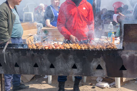 March 22, 2019 Almaty, Kazakhstan. Distribution of free national kebabs during the celebration of the holiday Nauryzのeditorial素材