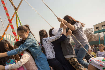March 22, 2019 Almaty, Kazakhstan. Children playing during the celebration of Nauryz holidayのeditorial素材
