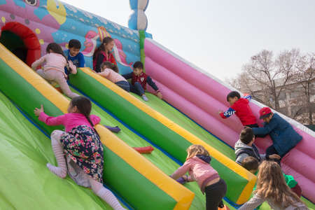 March 22, 2019 Almaty, Kazakhstan. Children playing during the celebration of Nauryz holidayのeditorial素材