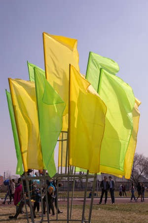 March 22, 2019 Almaty, Kazakhstan. Decorative colored flags stand during the celebration of the...