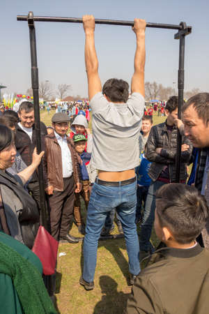 March 22, 2019 Almaty, Kazakhstan. Sports competitions in the horizontal bar during the celebration...