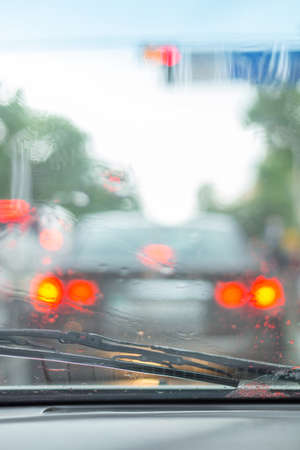 auto wipers wash windshield when driving in rain
