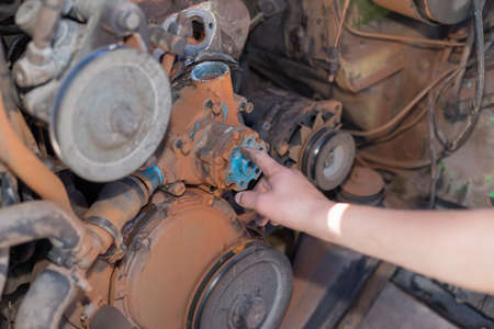 Engine repair close up. In hands toolの写真素材