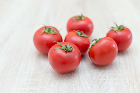 fresh tomatoes from the vegetable garden on white tableの写真素材