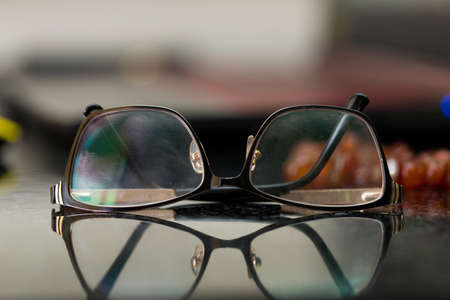 Brown glasses close-up. Glasses in a modern style. Glasses with clear lenses. fashionable accessoriesの写真素材