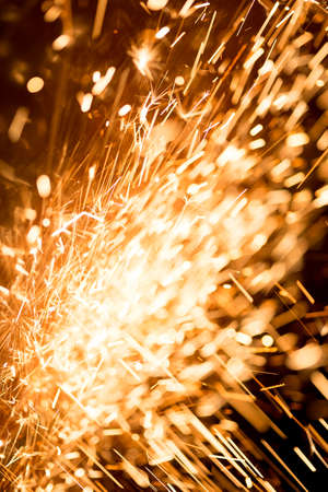 Glowing Flow of Sparks in the Darkの写真素材