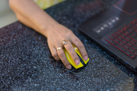 Close up of female hands use computer mountsの写真素材