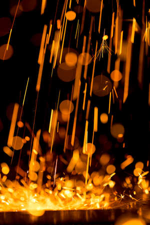 Glowing Flow of Sparks in the Darkの写真素材