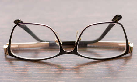 Brown glasses close-up. Glasses in a modern style. Glasses with clear lenses. fashionable accessoriesの写真素材