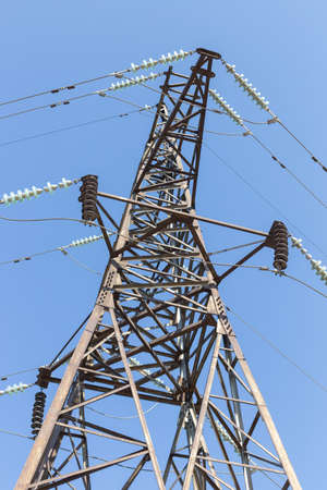 Power lines on a sunny day (high voltage tower)の写真素材