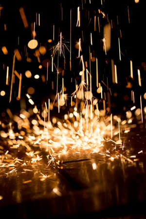 Glowing Flow of Sparks in the Darkの写真素材