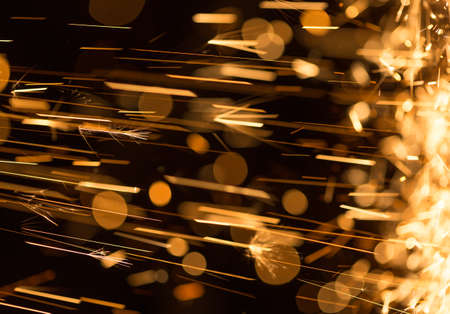 Glowing Flow of Sparks in the Darkの写真素材