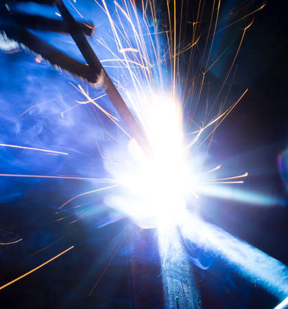 Welding sparks and smoke worker robot