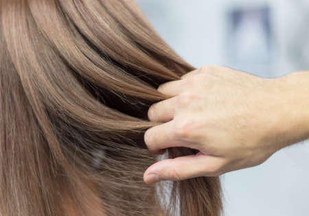 female head after lightening hair in a beauty salonの写真素材