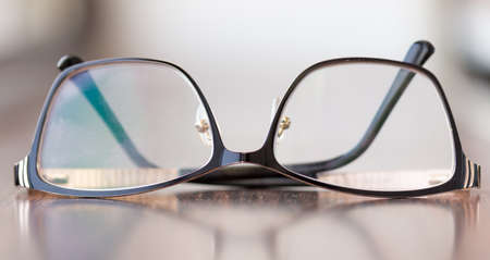 Brown glasses close-up. Glasses in a modern style. Glasses with clear lenses. fashionable accessoriesの写真素材