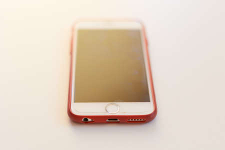Smartphone on White table with space for your textの写真素材