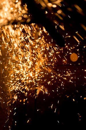 Glowing Flow of Sparks in the Darkの写真素材